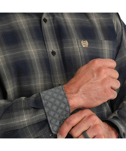 Close-up view of the navy buttons, plaid print, and contrast interior trim