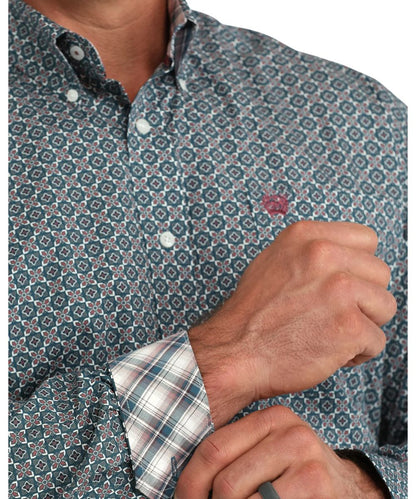 Close-up view of the men's blue long sleeve button down shirt featuring the geometric print and contrast interior trim