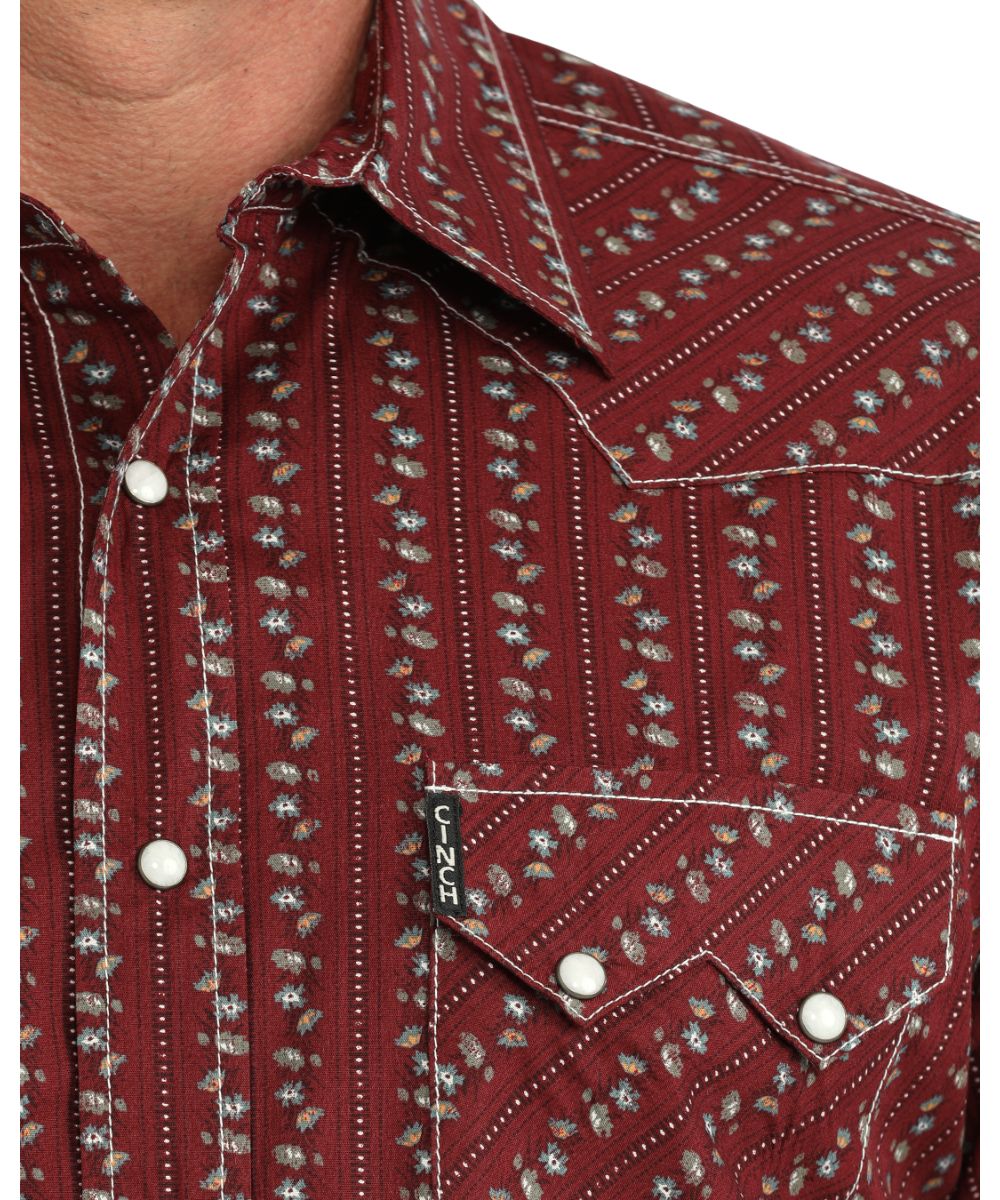 Close-up view of the floral striped print featuring the white marble snaps, spread collar, contrast topstitch, and sawtooth snap flap chest pockets