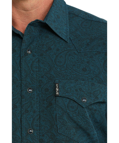 Close-up view of the men's paisley print teal snap shirt