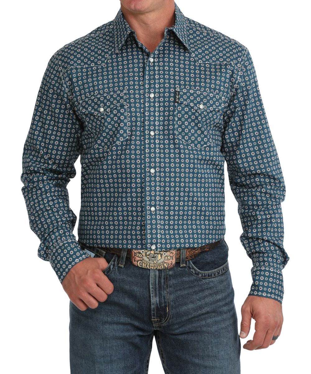 Front view of the men's blue Cinch long sleeve snap shirt featuring the modern fit, spread collar, white marble snaps, chest pockets, contrast topstitch, and geometric print
