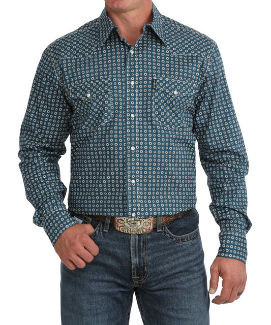 Front view of the men's blue Cinch long sleeve snap shirt featuring the modern fit, spread collar, white marble snaps, chest pockets, contrast topstitch, and geometric print