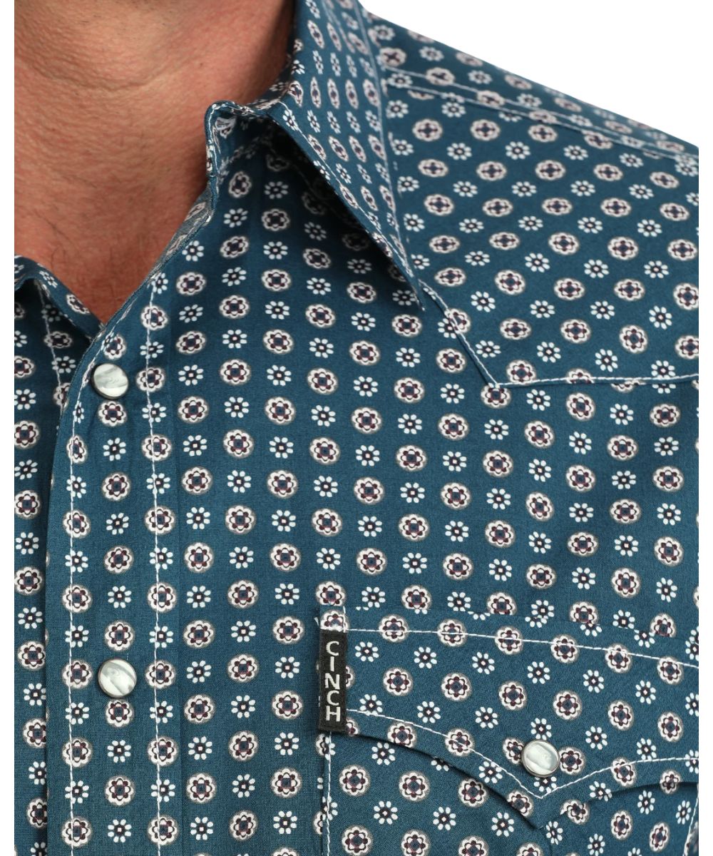 Close-up view of the white contrast topstitch and the geometric print