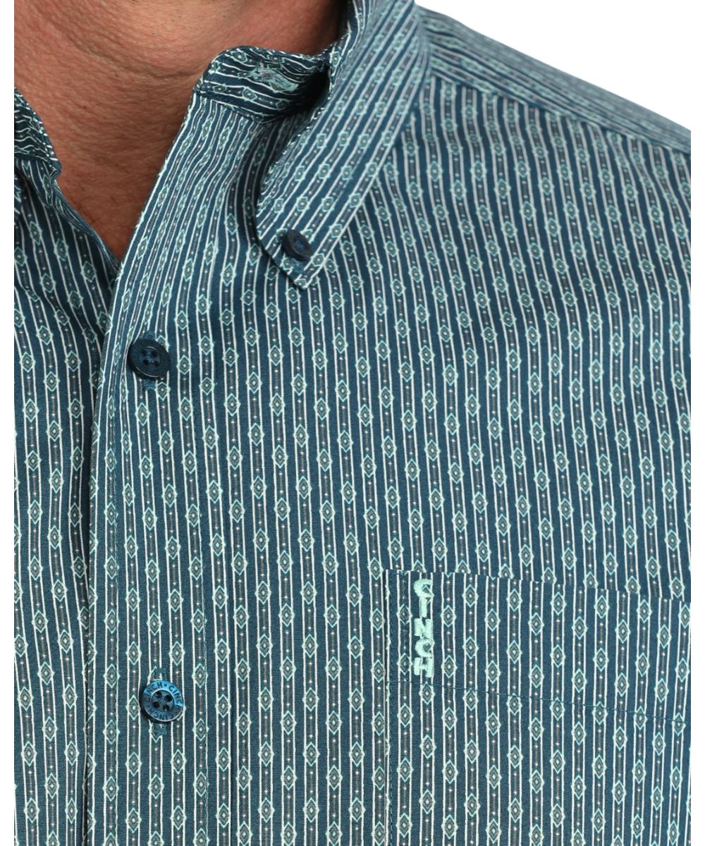 Close-up view of the men's blue long sleeve button down shirt featuring the diamond striped geometric print