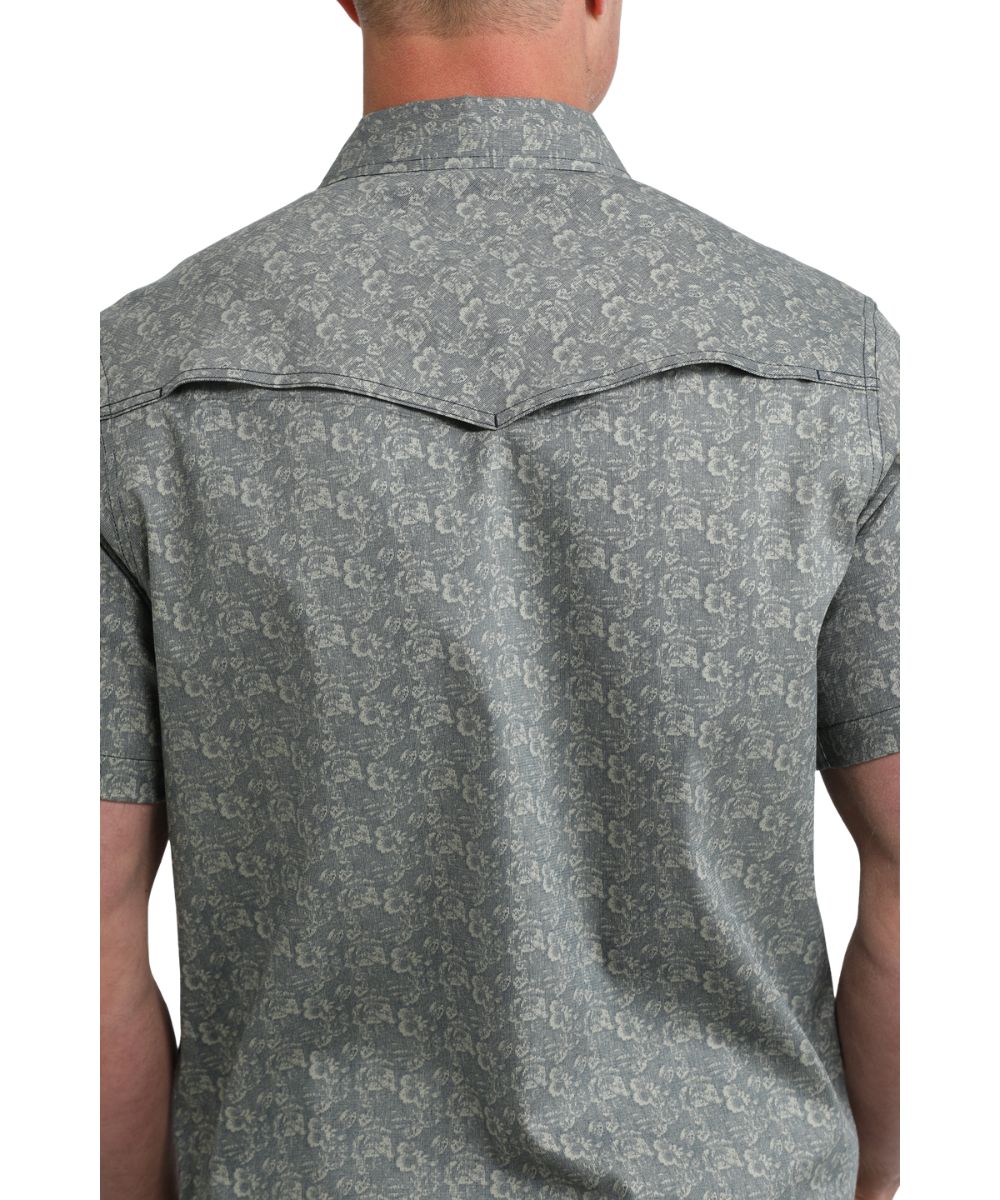 Back view of the men's navy snap shirt featuring a vented back yoke
