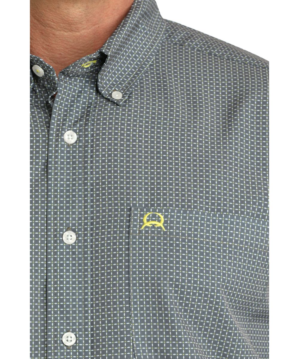 Close-Up View Of The Geometric Print, Chest Pocket, And Button Down Collar