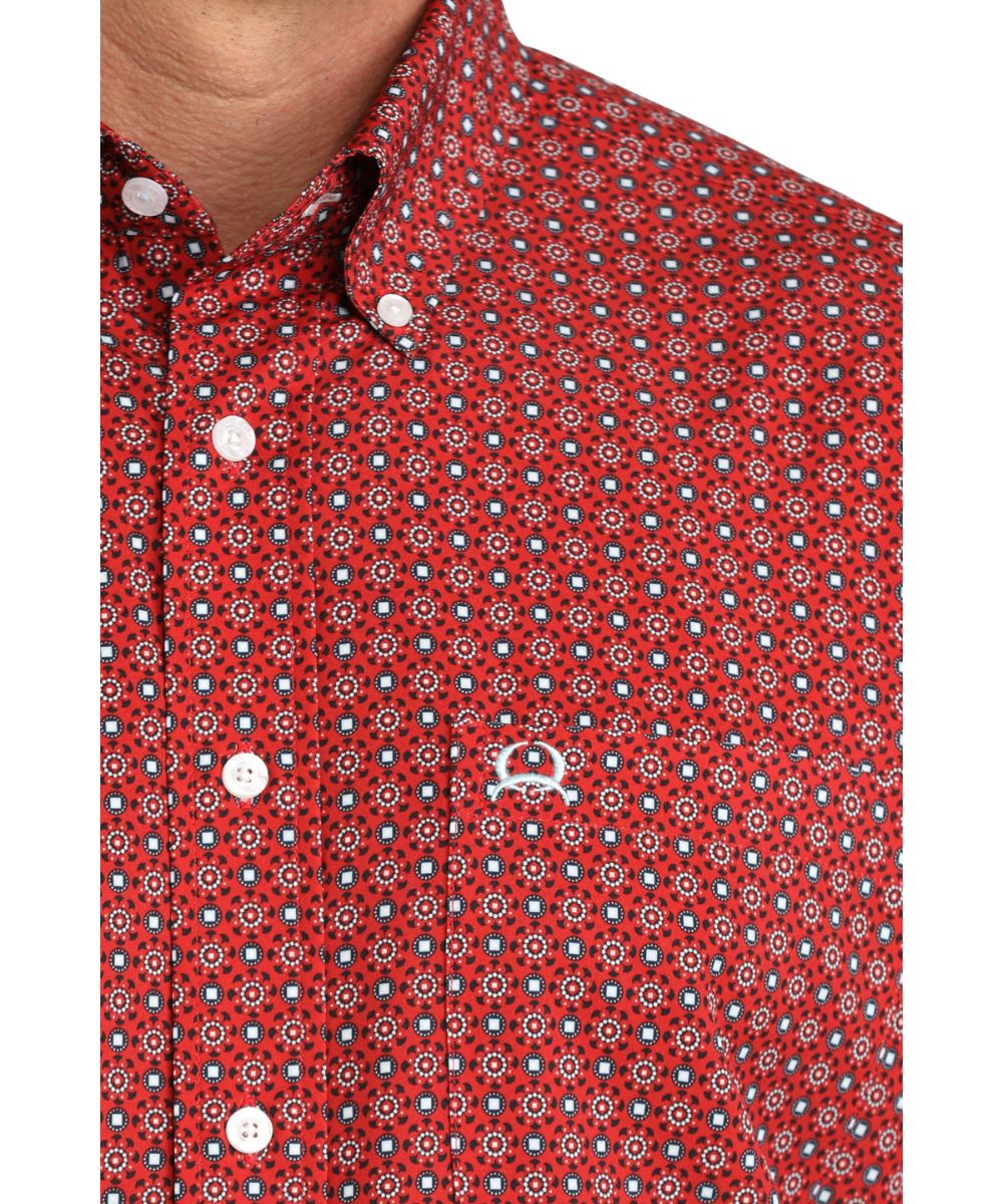 Close-up view of the red geometric men's button down shirt featuring the single open chest pocket, button down collar, and white buttons