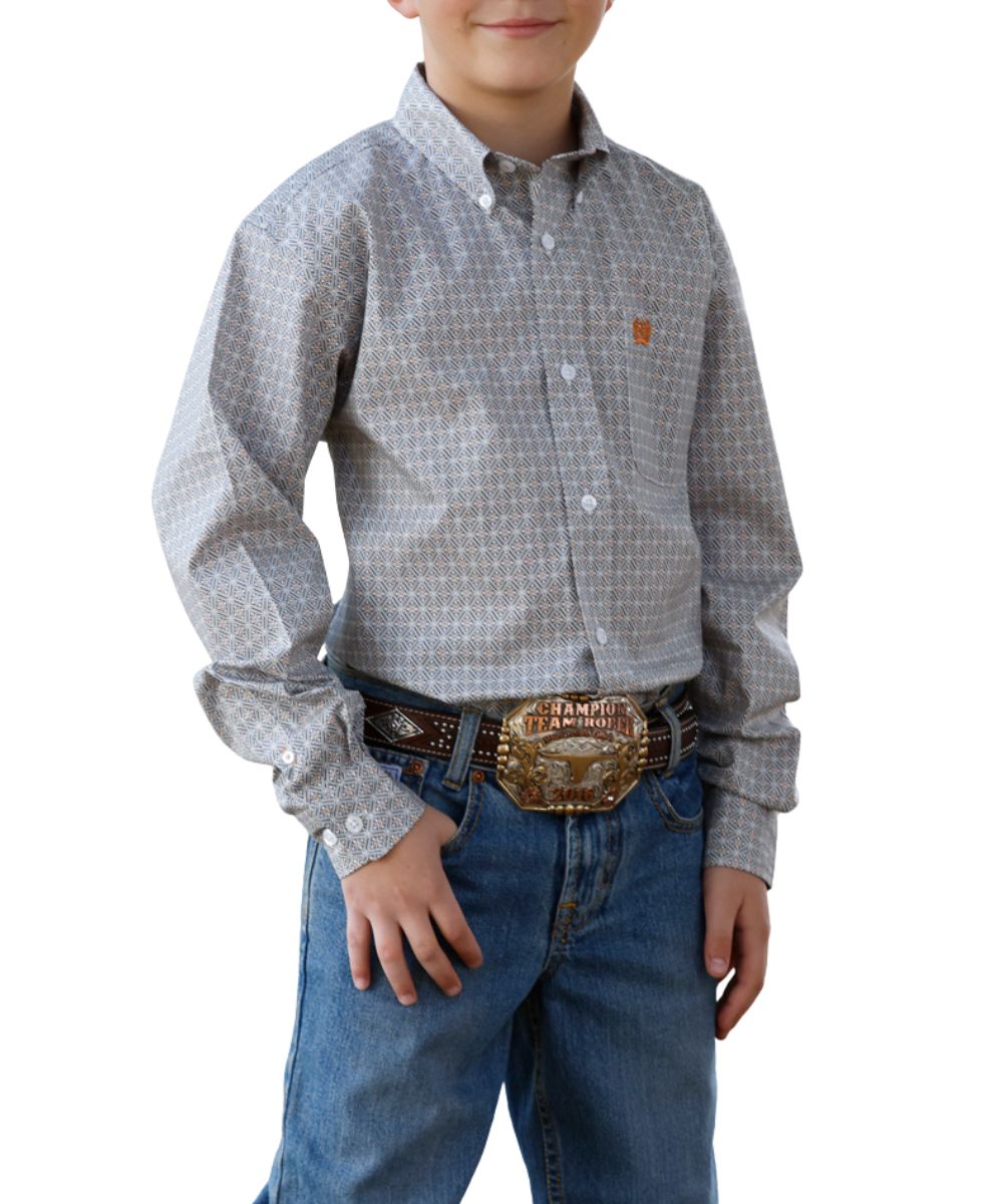 Front view of the boy's Cinch long sleeve button down shirt featuring the button down collar, single open chest pocket, grey geometric print, and white buttons