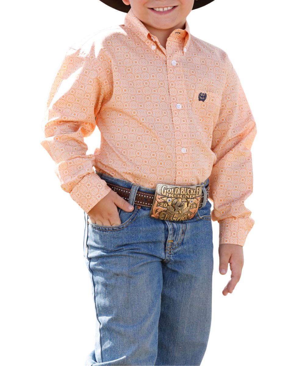 Front view of the boy's Cinch Gold Button Down Shirt featuring the long sleeves, button down collar, chest pocket, white buttons, and white geometric print