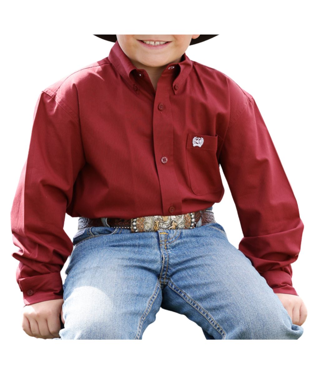 Front view of the boy's Cinch long sleeve burgundy button down shirt featuring the striped print, button down collar, and single open chest pocket