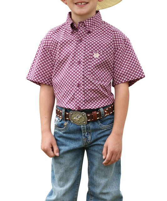 Front view of the boy's short sleeve button down shirt in purple with a white geometric print