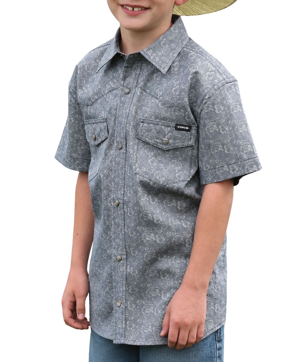 Front view of the boy's short sleeve navy floral print snap shirt
