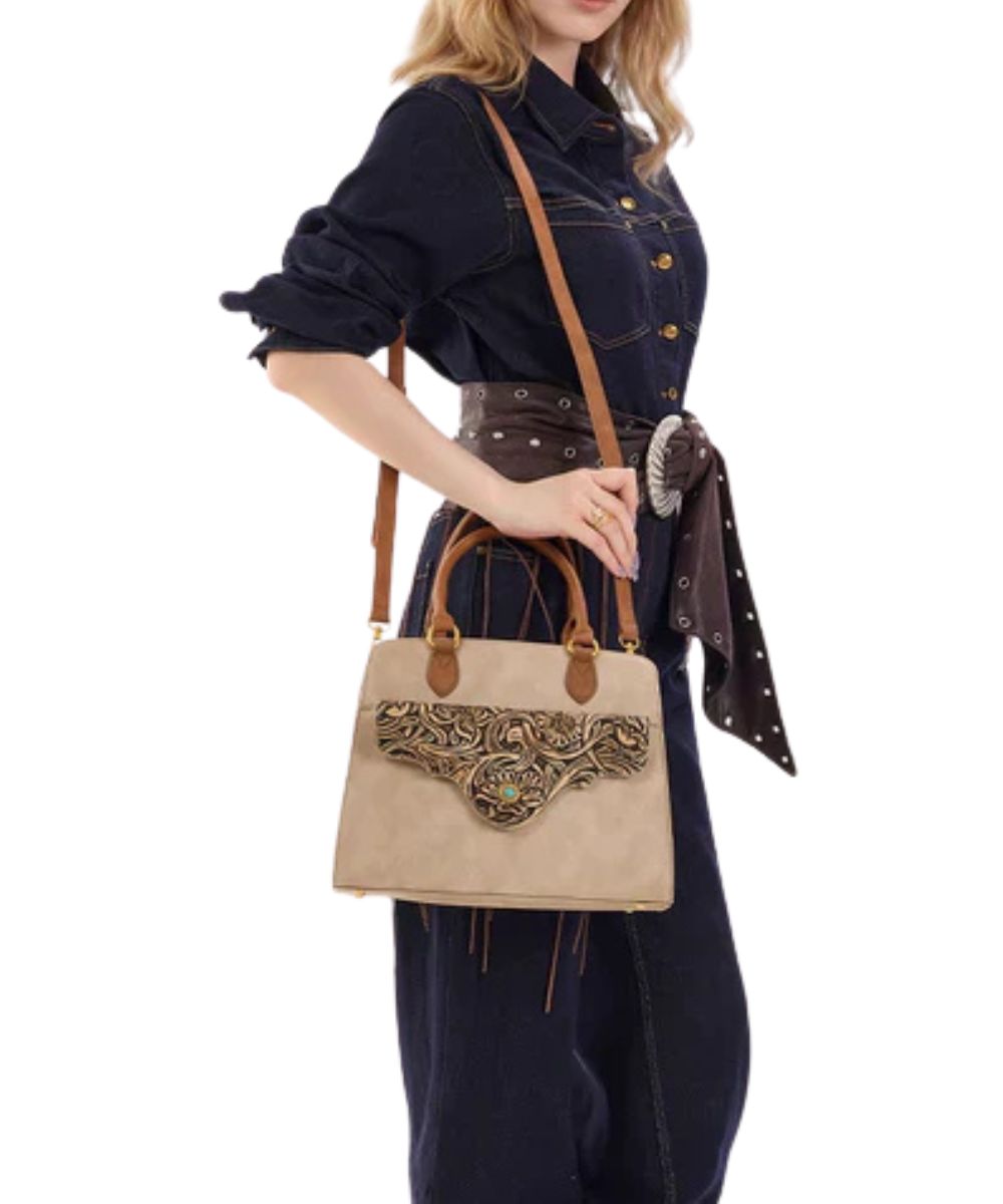 Model view of a woman modeling the tan concealed carry crossbody/satchel bag