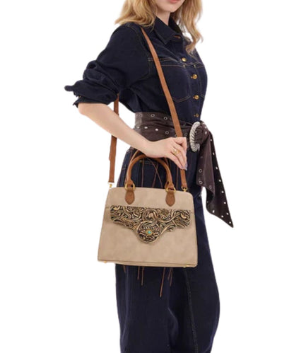 Model view of a woman modeling the tan concealed carry crossbody/satchel bag