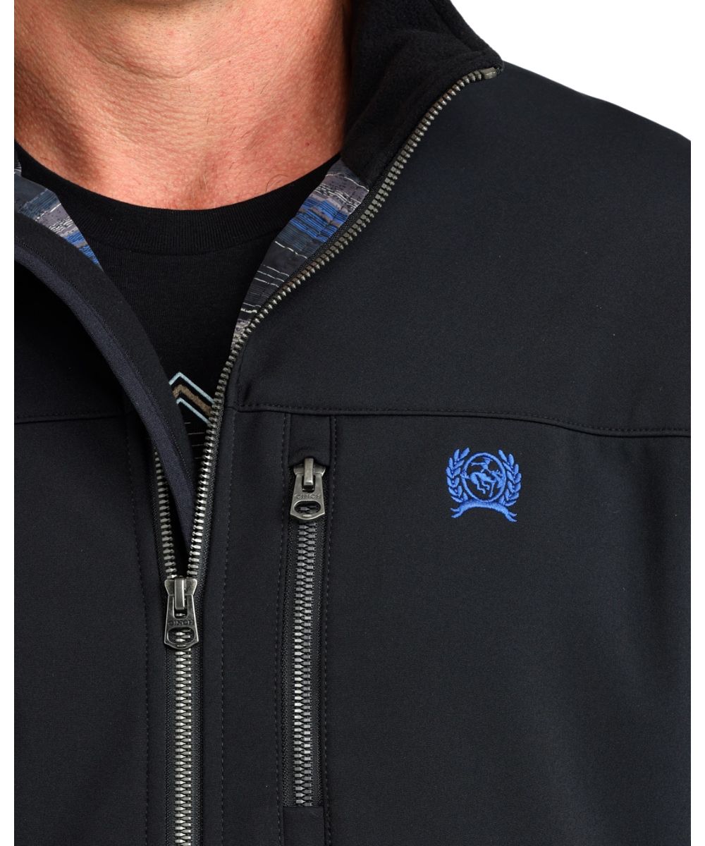 Close-up view of the black solid print and metaluxe zippers, this men's jacket features a durable water-resistant finish