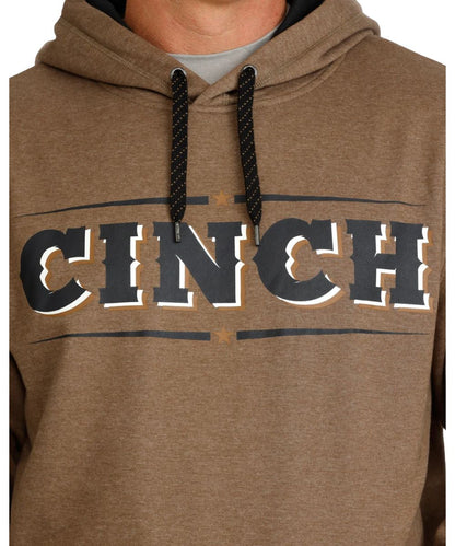 Close-up view of the bold logo screen printed on the front chest of the men's brown fleece logo hoodie