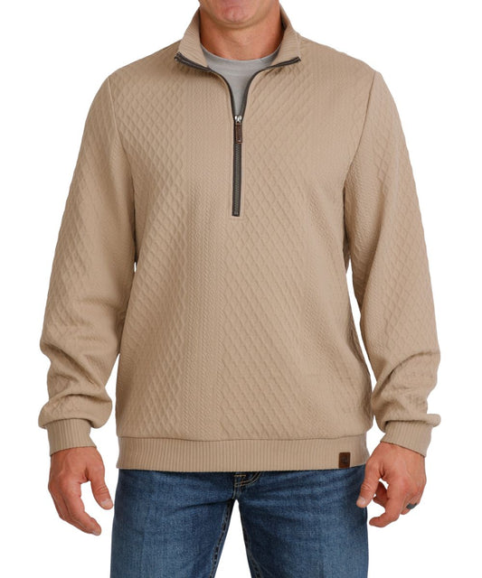 Front view of the men's stone/beige Cinch 1/2 zip pullover featuring the cable knit and diamond pattern design, 1/2 zip closure, mock collar, long sleeves, and leather logo patch at the hem