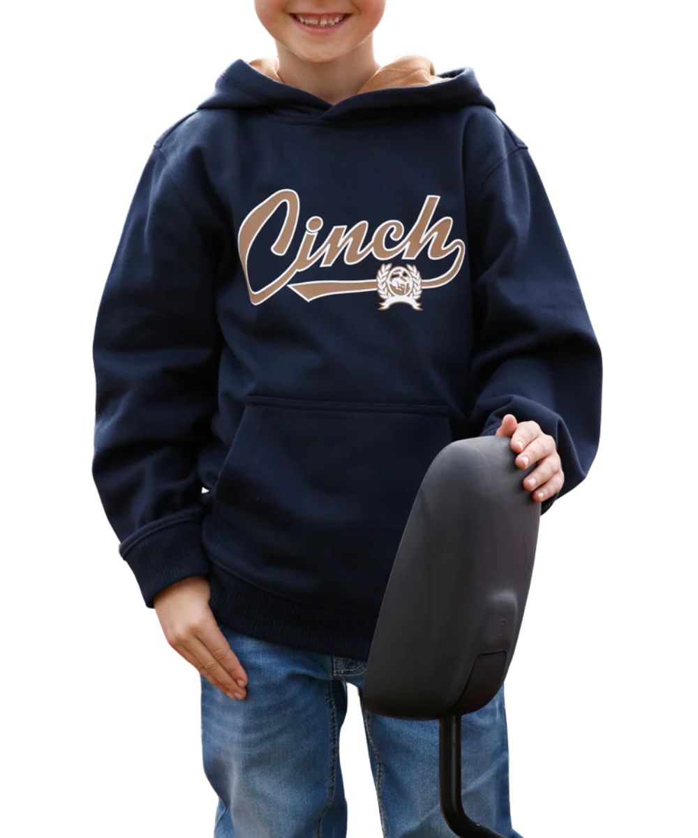 Front view of the boy's navy Cinch logo hoodie featuring the hooded collar with a contrast lining, Cinch screen-printed logo at the chest, kangaroo pocket, and rib knit trim