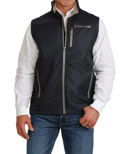 Front view of the men's navy Cinch Bonded Vest featuring the zip closure, zippered hand and chest pockets, mock collar, and logo embroidery
