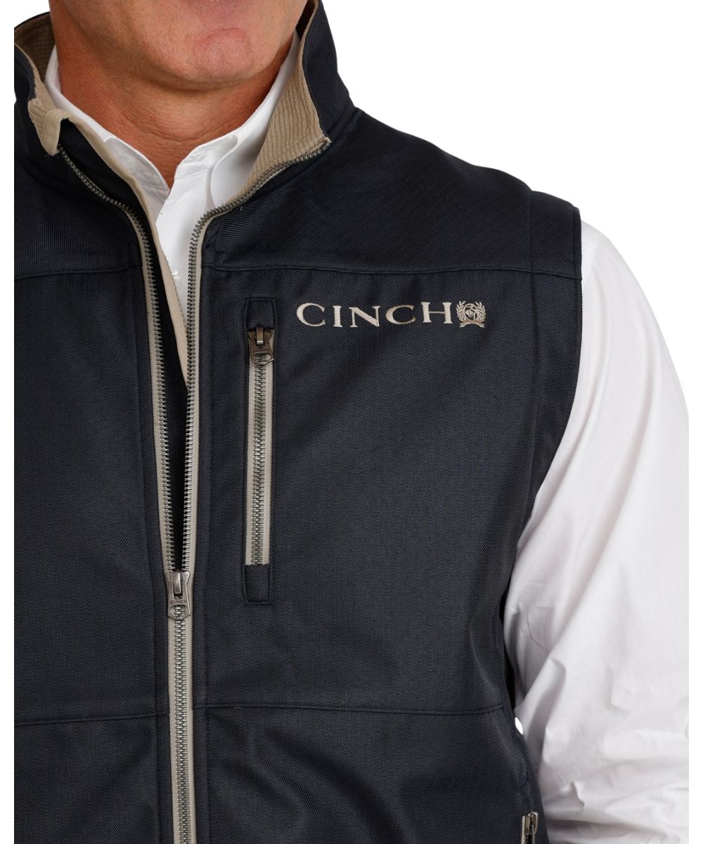 Close-up view of the men's textured polyester vest featuring the durable water-resistant finish