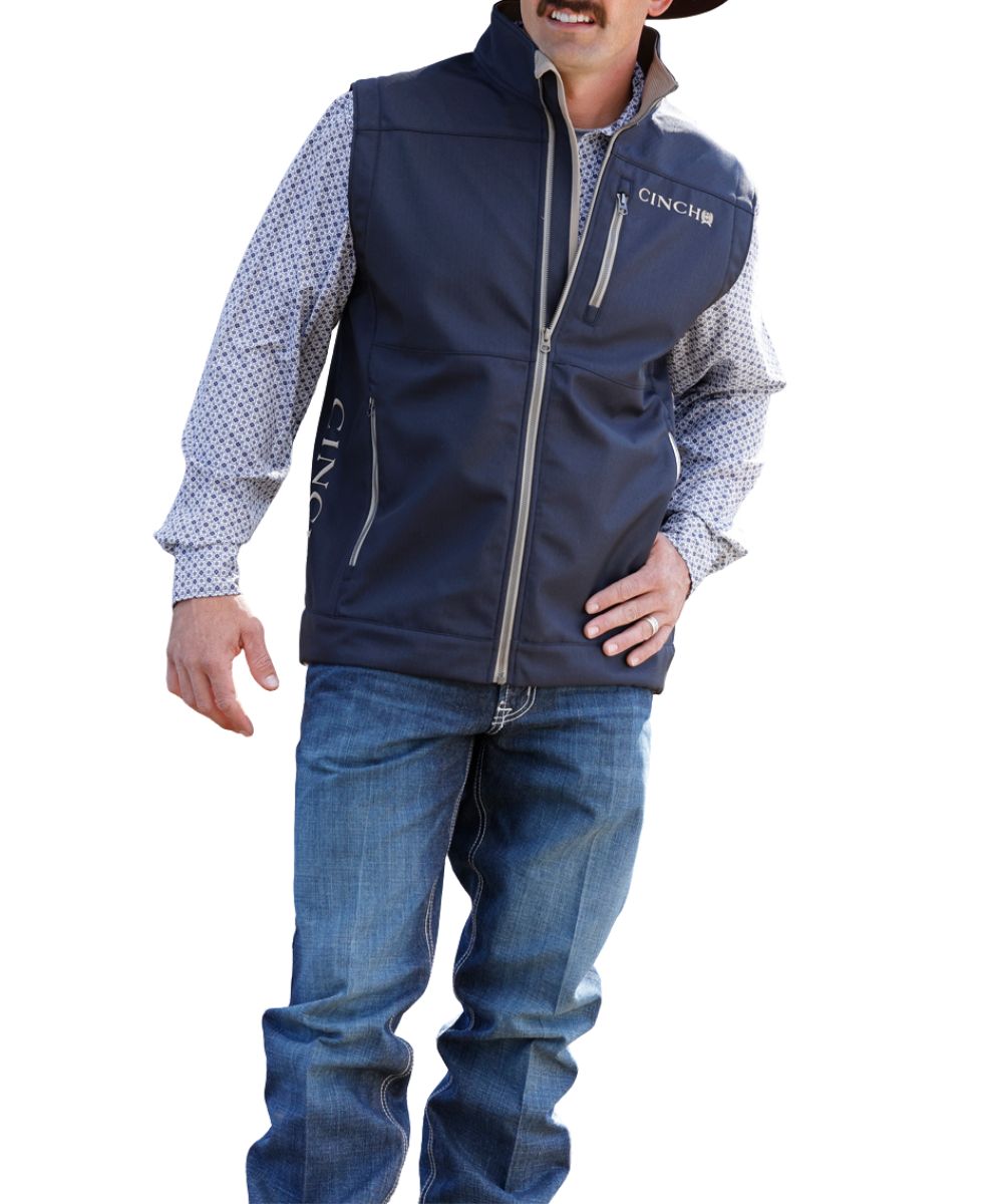 Side view of the men's navy vest featuring the logo embroidery at the left chest and lower right side panel