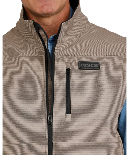 Close-up view of the zippered chest pocket and the horizontal lined print