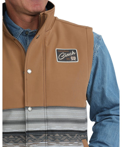 Close-up view of the woven logo label at the chest and the durable water-resistant finish