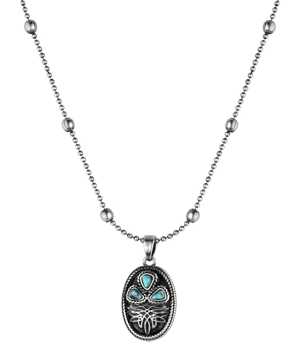 Front view of the women's silver necklace with an oval pendant featuring a boot stitch design and turquoise stones