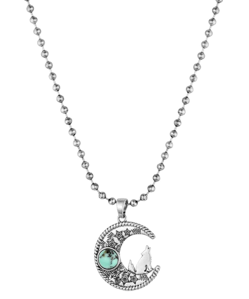 Front view of the women's silver coyote moon necklace featuring the crafted turquoise stone