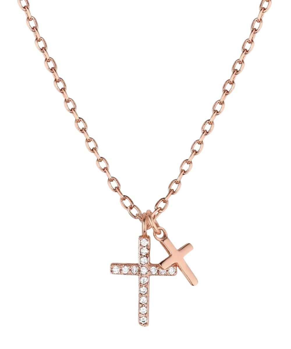 Front view of the women's rose gold tone cross shaped necklace featuring  clear cubic zirconia crystals and a smooth cross charm