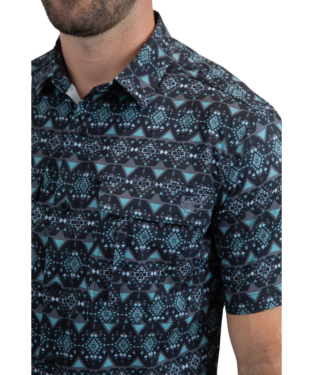 Close-up view of the black shirt with teal geometric print.