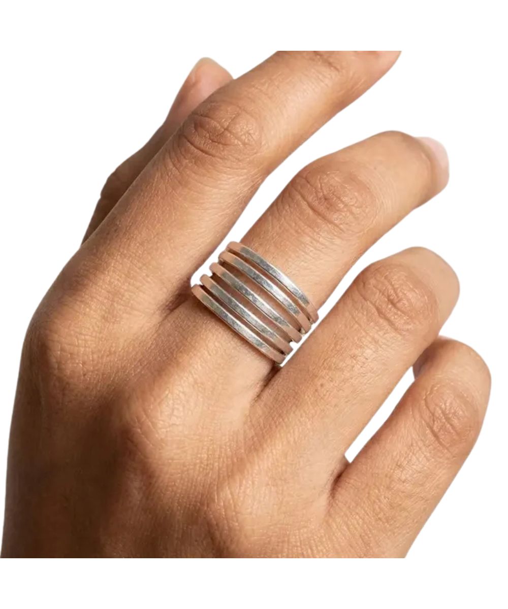 Women's silver five-banded artisan handcrafted ring modeled on a woman's hand