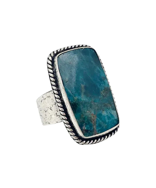Side view of the women's silver & blue handcrafted semiprecious apatite stone ring featuring the adjustable band, by Anju Jewelry