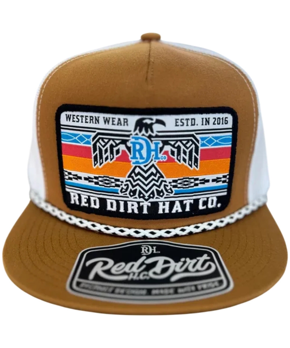 A brown and white trucker hat featuring a large embroidered front patch with a western design and the text 'RED DIRT HAT CO.' and 'WESTERN WEAR ESTD.