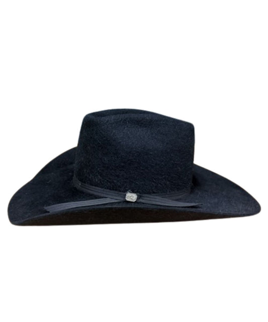 Side view of the black cowboy hat featuring the black hat band with silver logo buckle
