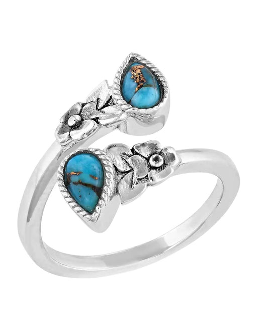 Top view of the women's silver wrap ring featuring the floral design and crafted turquoise stones