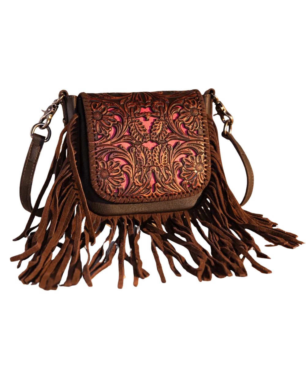 Front view of the women's coffee genuine leather Montana West crossbody purse featuring the vintage floral tooled front flap with matching color in-lay on the flap, magnetic button flap closure, leather fringe, and a removable/adjustable crossbody strap