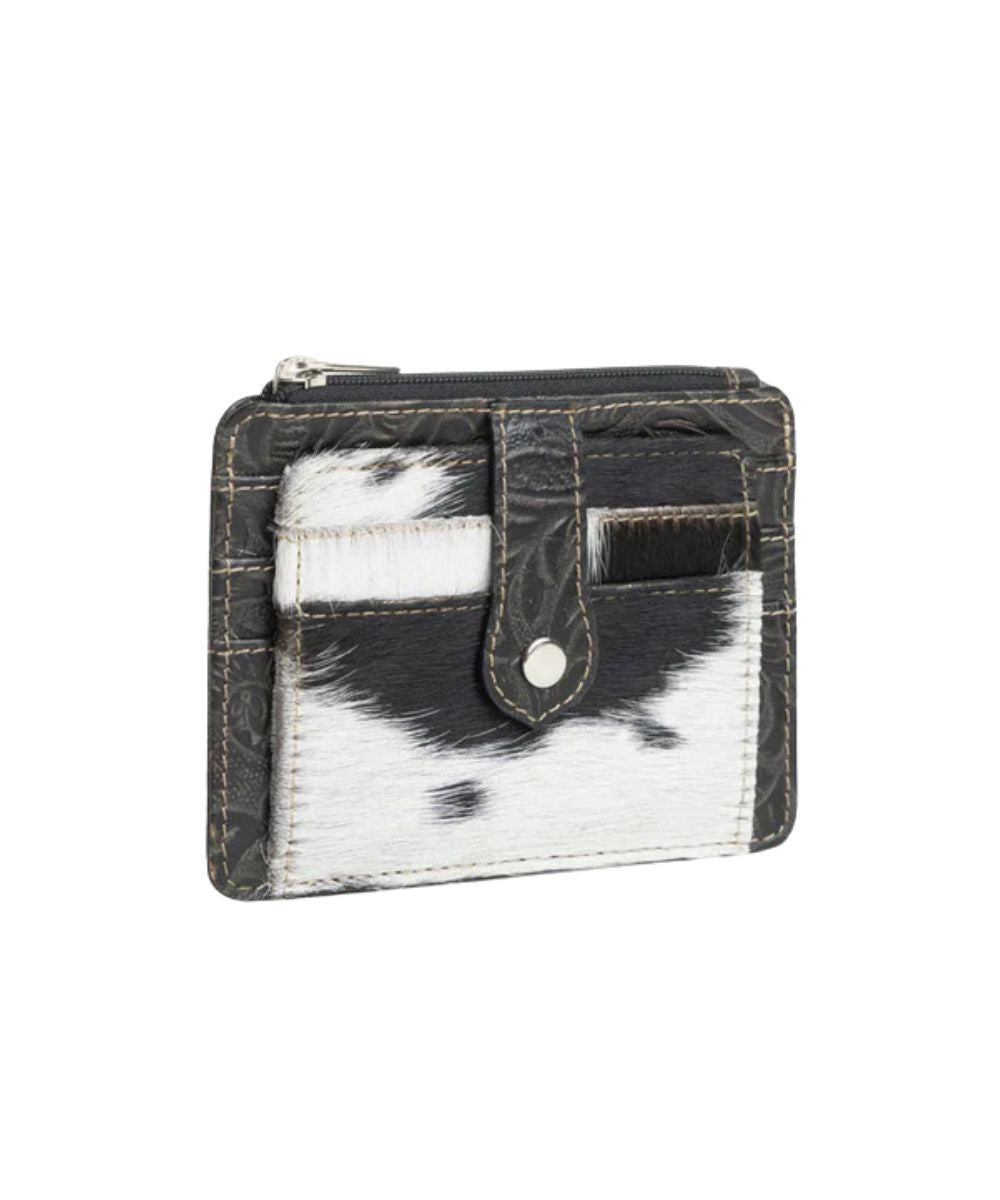 Front view of the Myra Bags women's Wonder Trail card wallet featuring black and white hair-on-hide cowhide leather with 2 card slots on the front.