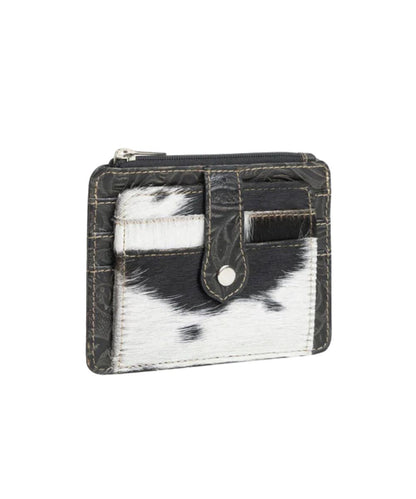 Front view of the Myra Bags women's Wonder Trail card wallet featuring black and white hair-on-hide cowhide leather with 2 card slots on the front.