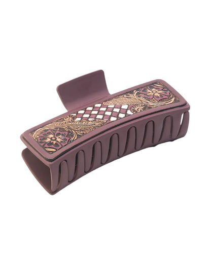 Women's ebony cream plastic claw clip featuring checkered and floral tooled leather overlays.