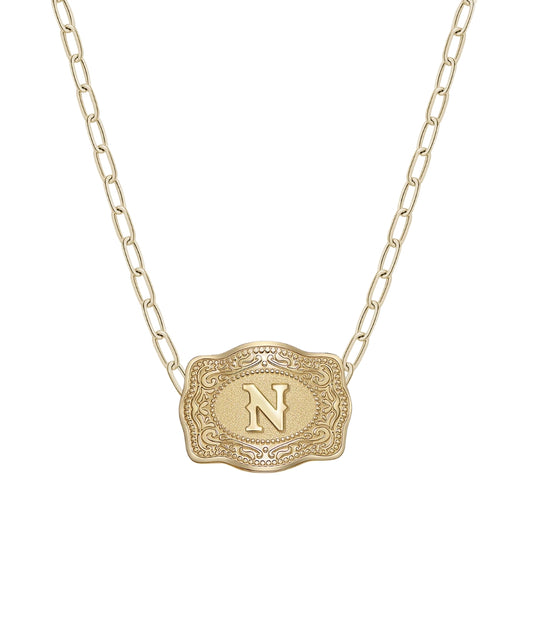 mini gold belt buckle n initial necklace on white background