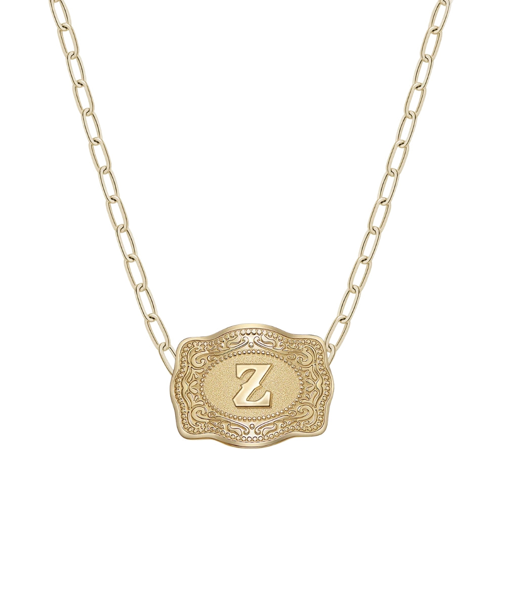 mini gold belt buckle z initial necklace on white background