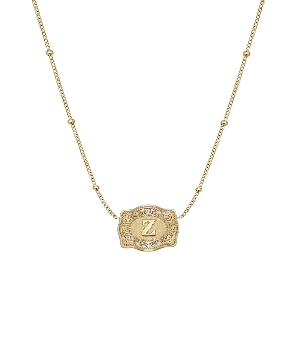 ultra mini gold belt buckle z initial necklace on white background