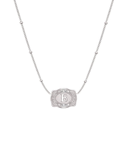 ultra mini silver belt buckle b initial necklace on white background