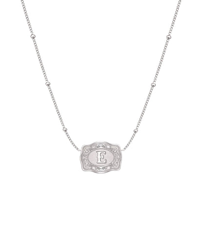 ultra mini silver belt buckle e initial necklace on white background