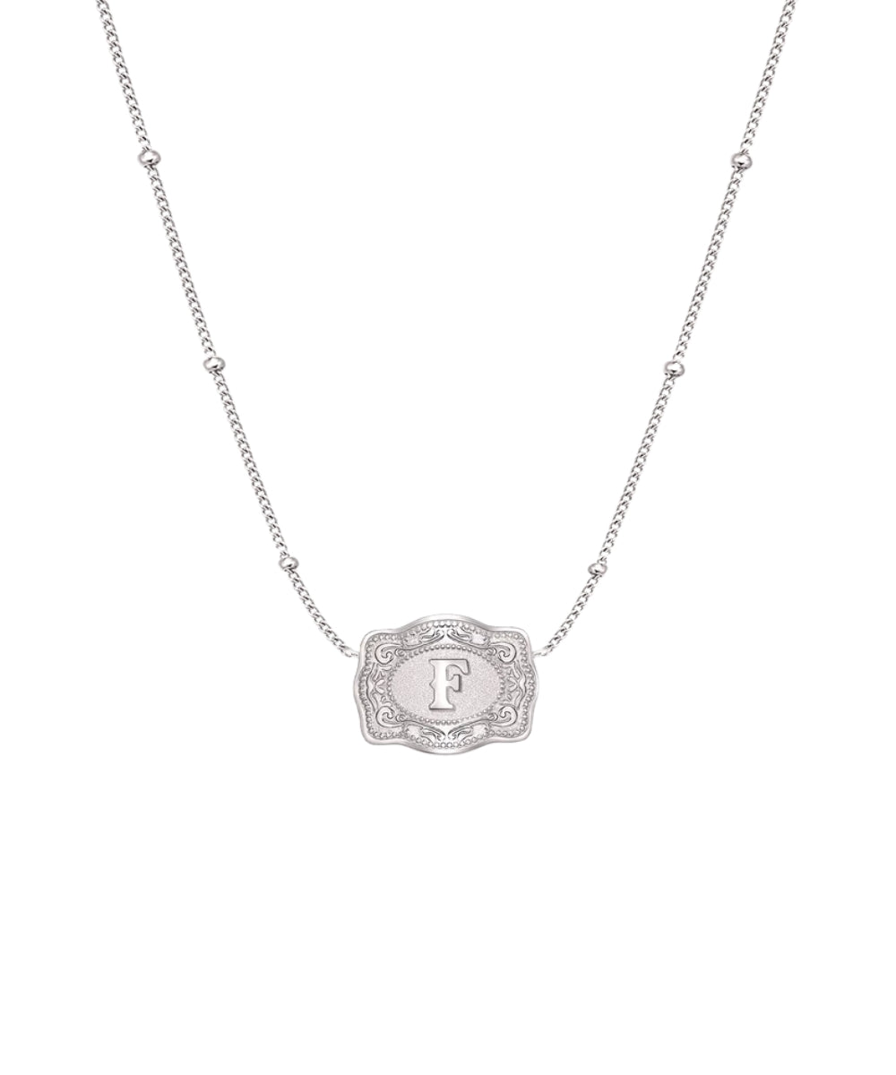 ultra mini silver belt buckle f initial necklace on white background