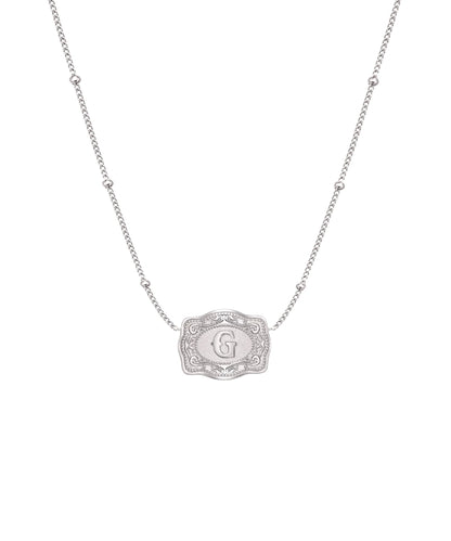 ultra mini silver belt buckle g initial necklace on white background