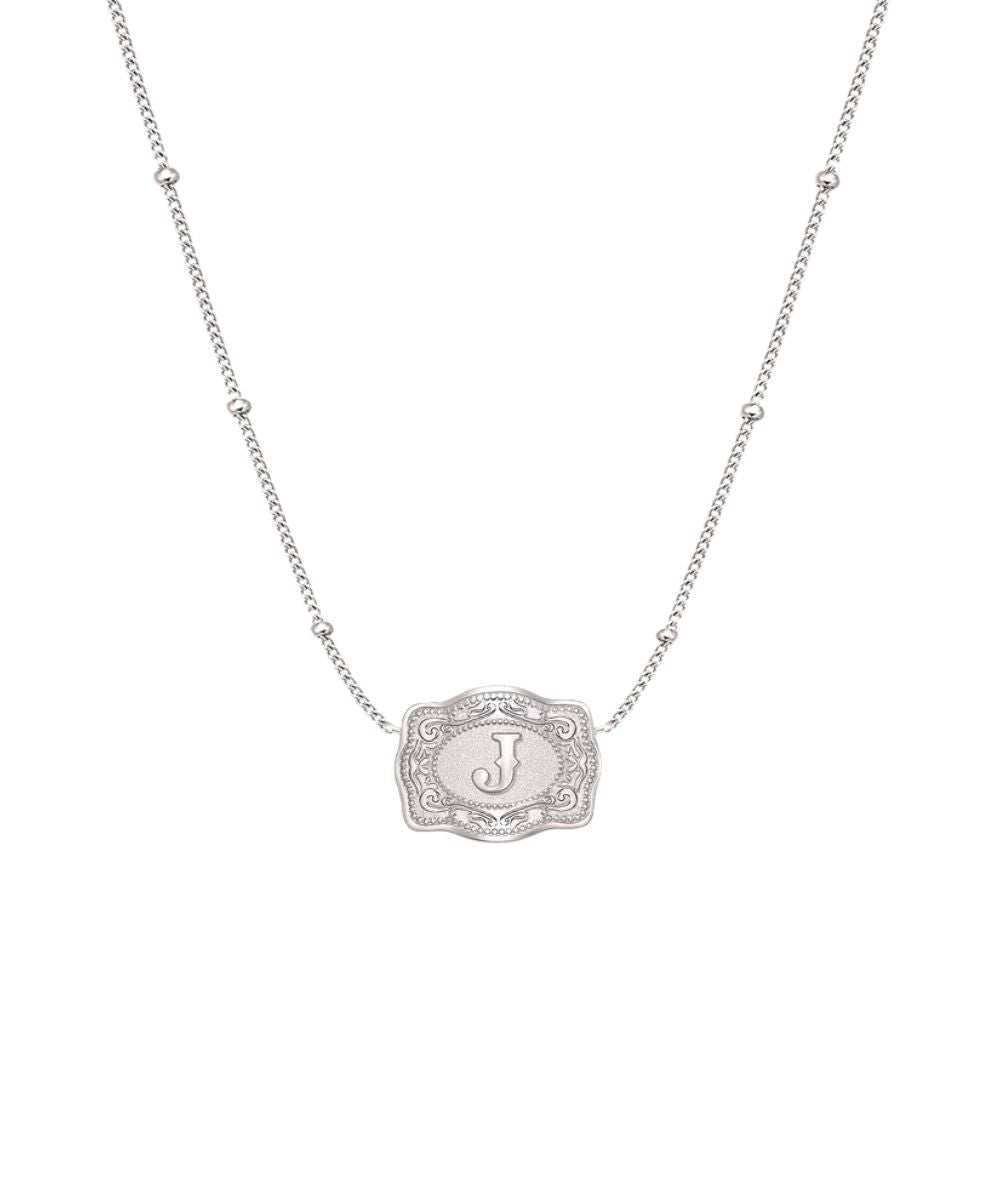 ultra mini silver belt buckle j initial necklace on white background