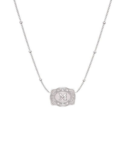 ultra mini silver belt buckle m initial necklace on white background