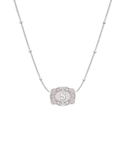 ultra mini silver belt buckle necklace s initial on white background